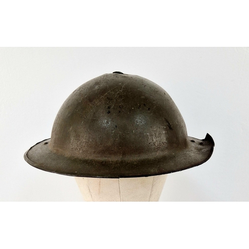 783 - WW2 British MK II Helmet with Shrapnel Damage. This was found in a French Flea Market near Ouistreha... 