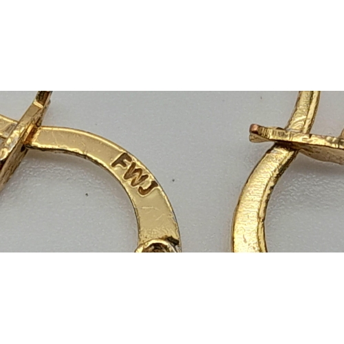 1059 - A large pair of gold tone hoop earrings. Diameter: 4 cm, weight: 7.4 g.