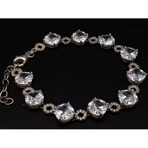 1396 - New Sterling Silver and Cubic Zirconia Set Bracelet. 20cm Length. Set with 10 x 8mm Round Cut Zircon... 