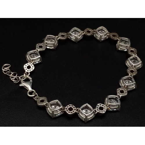 1396 - New Sterling Silver and Cubic Zirconia Set Bracelet. 20cm Length. Set with 10 x 8mm Round Cut Zircon... 