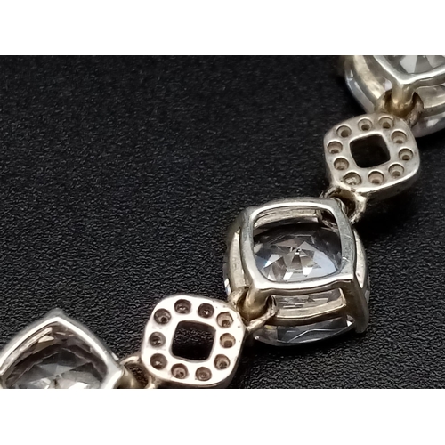 1396 - New Sterling Silver and Cubic Zirconia Set Bracelet. 20cm Length. Set with 10 x 8mm Round Cut Zircon... 