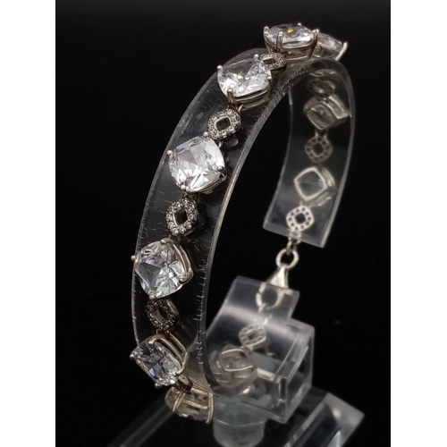 1396 - New Sterling Silver and Cubic Zirconia Set Bracelet. 20cm Length. Set with 10 x 8mm Round Cut Zircon... 