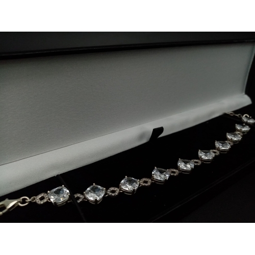 1396 - New Sterling Silver and Cubic Zirconia Set Bracelet. 20cm Length. Set with 10 x 8mm Round Cut Zircon... 