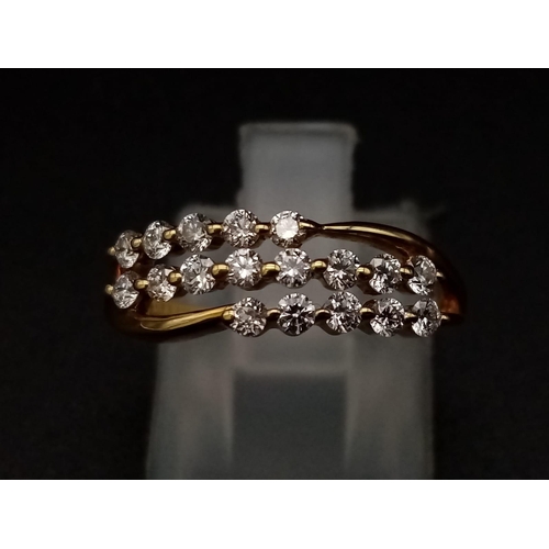 306 - An 18K yellow gold ring with three diamond bands (0.36 carats). Ring size: J, weight: 2.4 g.