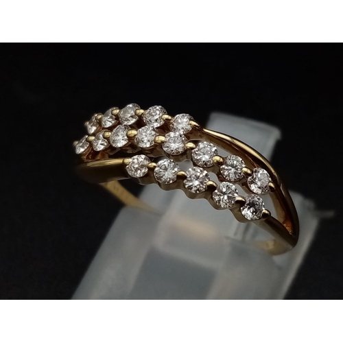 306 - An 18K yellow gold ring with three diamond bands (0.36 carats). Ring size: J, weight: 2.4 g.