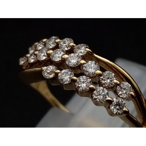 306 - An 18K yellow gold ring with three diamond bands (0.36 carats). Ring size: J, weight: 2.4 g.