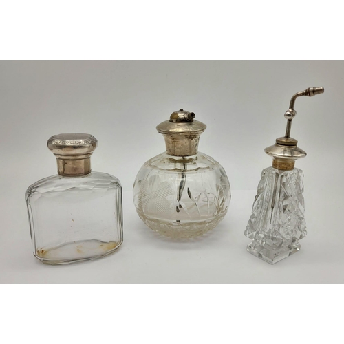 1038 - Three Wonderful Antique Glass and Silver Topped Perfume Bottles. All with their own distinctive styl... 