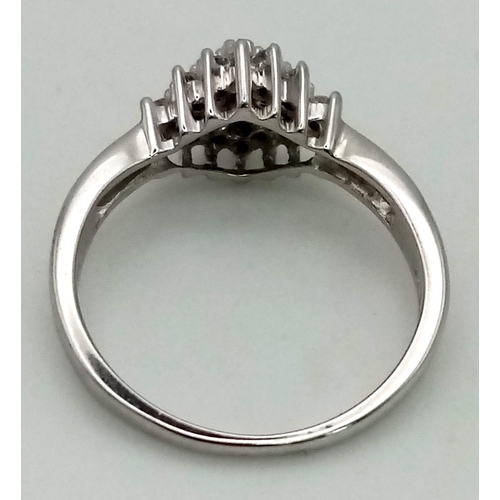 457 - A 9K white gold ring with a diamond cluster (0.23 carats). Ring size: I/J, weight: 2.2 g.