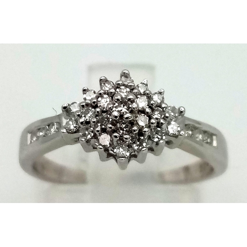 457 - A 9K white gold ring with a diamond cluster (0.23 carats). Ring size: I/J, weight: 2.2 g.