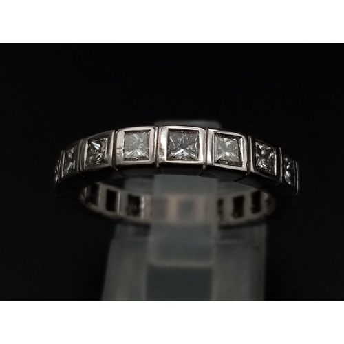 1040 - A platinum eternity ring with Princess cut diamonds (app. 2.5 carats). Ring size: N, weight: 5 g.