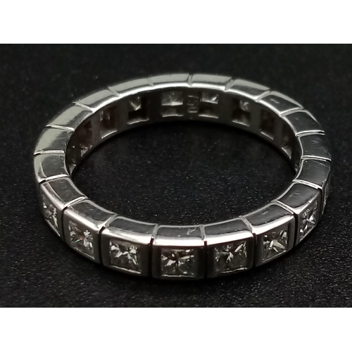 1040 - A platinum eternity ring with Princess cut diamonds (app. 2.5 carats). Ring size: N, weight: 5 g.