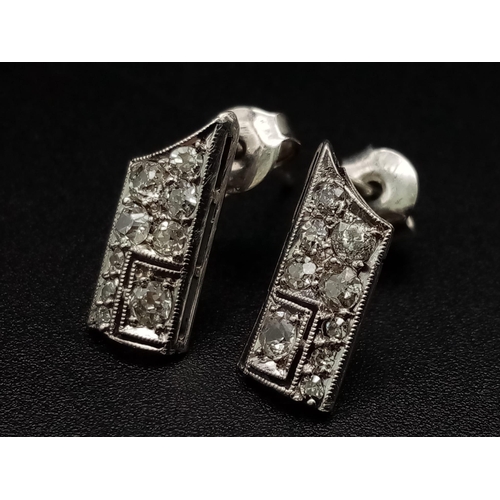 1221 - An interesting ART DECO pair of platinum earrings with diamonds. Weight: 1.65 g.