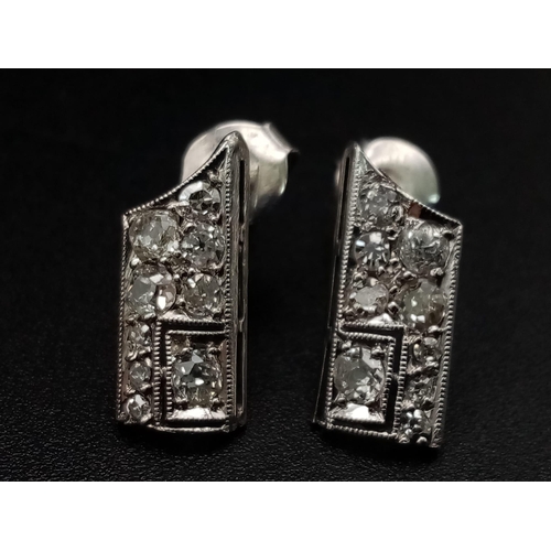 1221 - An interesting ART DECO pair of platinum earrings with diamonds. Weight: 1.65 g.