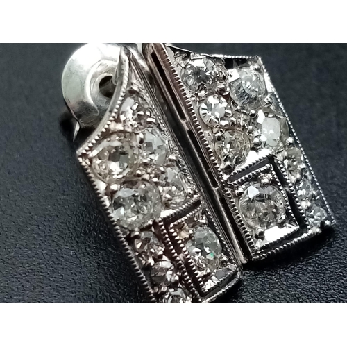 1221 - An interesting ART DECO pair of platinum earrings with diamonds. Weight: 1.65 g.