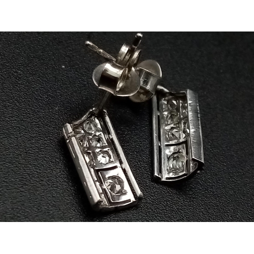 1221 - An interesting ART DECO pair of platinum earrings with diamonds. Weight: 1.65 g.