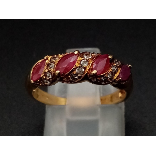 1241 - A 9K yellow gold ring with four marquis cut rubies alternating with diamonds. Ring size: N, weight: ... 