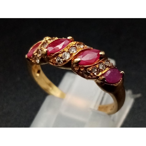 1241 - A 9K yellow gold ring with four marquis cut rubies alternating with diamonds. Ring size: N, weight: ... 