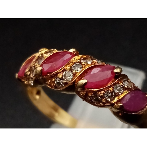 1241 - A 9K yellow gold ring with four marquis cut rubies alternating with diamonds. Ring size: N, weight: ... 