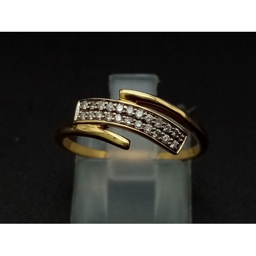 276 - An 18K yellow gold ring with two diamond cross over bands.  (diamonds 0.10 carats). Ring size: M1/2,... 