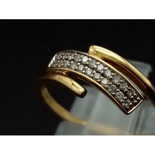 276 - An 18K yellow gold ring with two diamond cross over bands.  (diamonds 0.10 carats). Ring size: M1/2,... 