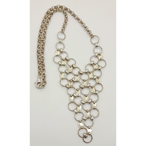 570 - A sterling silver, bib style necklace on 16