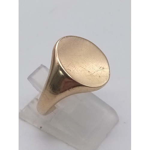 1164 - 9K YELLOW GOLD OVAL SIGNET RING - 9G TOTAL WEIGHT. SIZE P