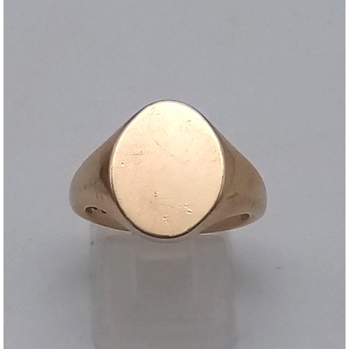 1164 - 9K YELLOW GOLD OVAL SIGNET RING - 9G TOTAL WEIGHT. SIZE P