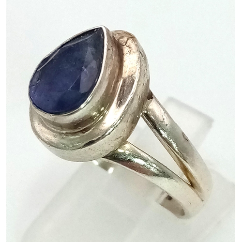 1412 - STERLING SILVER BLUE STONE SET RING 6.7G. Size P