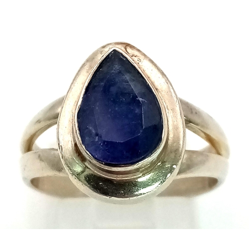 1412 - STERLING SILVER BLUE STONE SET RING 6.7G. Size P