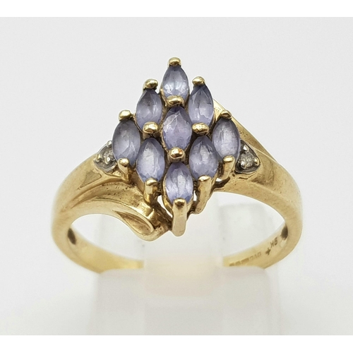 1424 - 9K YELLOW GOLD DIAMOND & IOLITE FANCY CLUSTER RING. 3G TOTAL WEIGHT. SIZE O