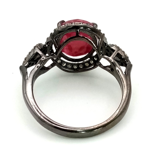 1286 - 925 Silver Ruby Ring with Diamond Accents. Total Weight 3.36grams. Size L.