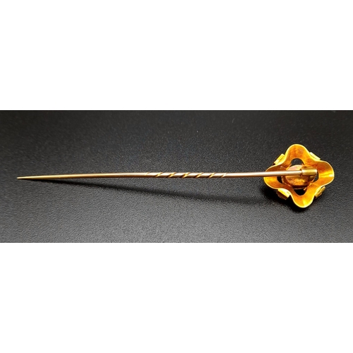 1282 - A Victorian High-Karat Gold and Almadine Cabochon Long Stick Pin. 8cm. 3.23g total weight. Comes in ... 