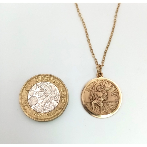 1018 - A 9K yellow gold St Christopher pendant on a chain. Pendant diameter: 20 mm, total weight: 3.55 g.