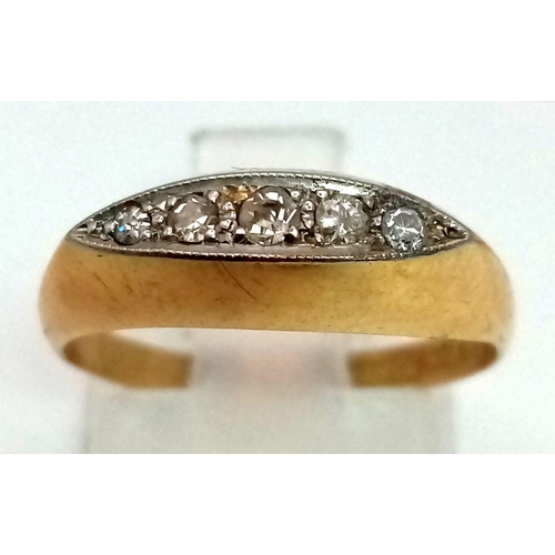 1273 - A vintage, 18K yellow gold ring with a row of five diamonds on top. Ring size: M, weight: 2.16 g.