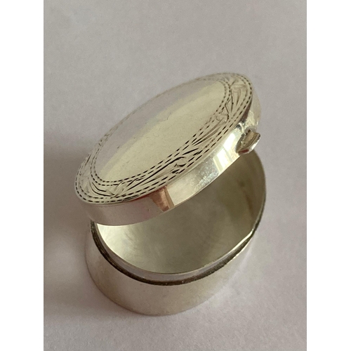 161 - SILVER PILL BOX with full UK hallmark.Oval shape with chased design to lid border. Exceptional condi... 