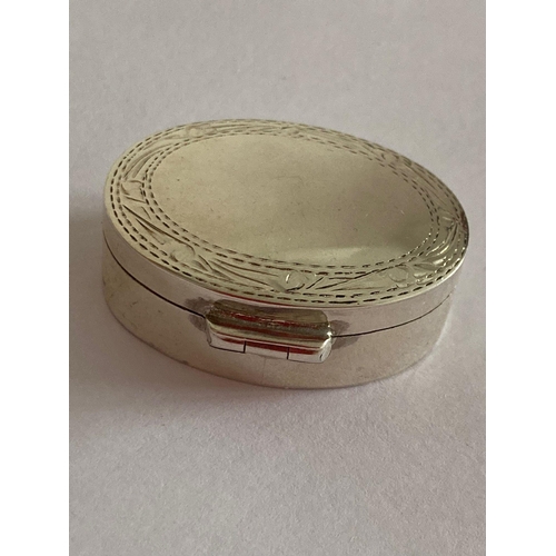 161 - SILVER PILL BOX with full UK hallmark.Oval shape with chased design to lid border. Exceptional condi... 