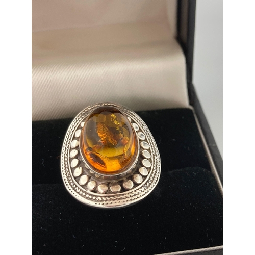 175 - Vintage AMBER CABOCHON SILVER RING, having oval Amber Cabochon Mounted to top with attractive curved... 