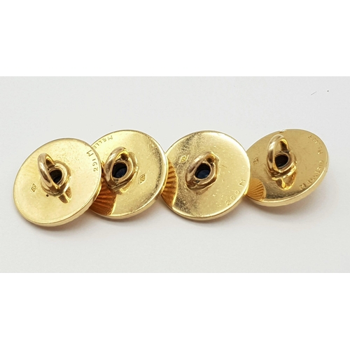 205 - 4 1940'S 18K GOLD AND SAPPHIRE BUTTONS .   12.1gms