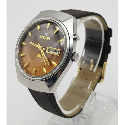 A Vintage Ricoh 21 Jewel Automatic Gents Watch. Brown leather strap with golden brown dial. Stainles