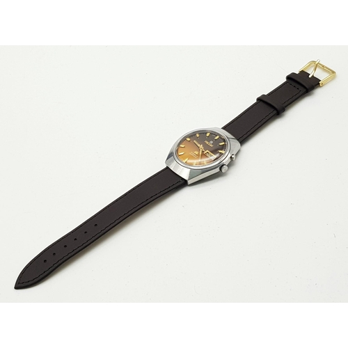 344 - A Vintage Ricoh 21 Jewel Automatic Gents Watch. Brown leather strap with golden brown dial. Stainles... 