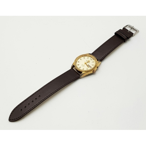 351 - A Vintage Orient 21 Jewel Crystal Gents Watch. Brown leather strap. Two tone case - 36mm. Gold tone ... 