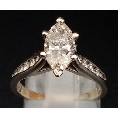 1504 - A 14K White Gold Marquise-Cut Diamond Ring. 1.5ct central stone with a further ten graduated round c... 