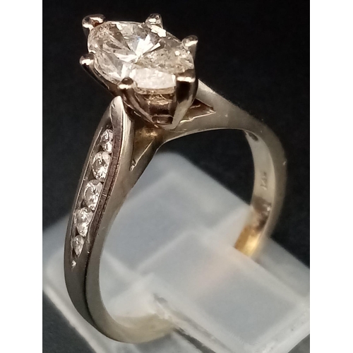 1504 - A 14K White Gold Marquise-Cut Diamond Ring. 1.5ct central stone with a further ten graduated round c... 