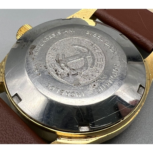 1552 - A Vintage Tressa 25 Jewel Incabloc Automatic Gents Watch. Brown leather strap. Two tone case - 34mm.... 