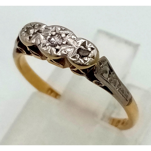 1560 - A VINTAGE 18K GOLD AND DIAMOND TRILOGY RING WITH PLATINUM SETTING.   2.2gms      size K