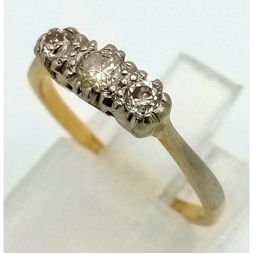 1557 - A Vintage 18K Gold and Platinum Diamond Trilogy Ring. Size L/M. 2.27g total weight.