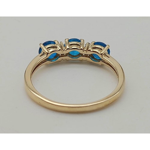 1574 - 10K Yellow Gold Ring with Trilogy of Bright Blue Stones, Buffered by white CZ. 2.5grams Size S.