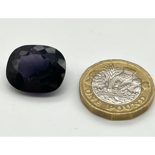 781 - A 23ct Purple-Coloured Oval Shape Gemstone. 20 x 18mm. No certificate so as found