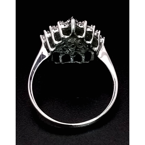 1254 - A 9K WHITE GOLD TEAR DROP CLUSTER RING.  2.7gms   size J