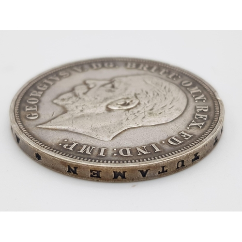 1167 - A 1935 George V Silver Rocking Horse Crown Coin. Please see photos for conditions.